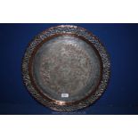 A plated and copper Charger with bird and animal detail to the centre and open work rim,