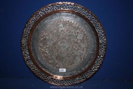 A plated and copper Charger with bird and animal detail to the centre and open work rim,