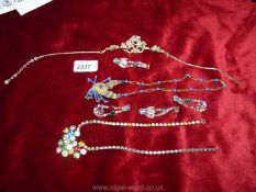 A quantity of vintage costume jewellery including ear rings,