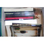 A box of antiques sales catalogues