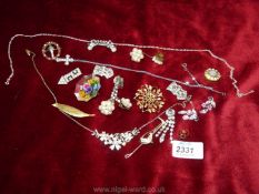 A quantity of vintage brooches, dress clips, ear rings etc.