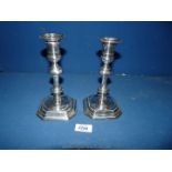 A pair of plated Candlesticks 7 1/2" tall, one having silver insert.