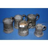 Four Pewter pint Tankards and a 1/2 pint tankard,