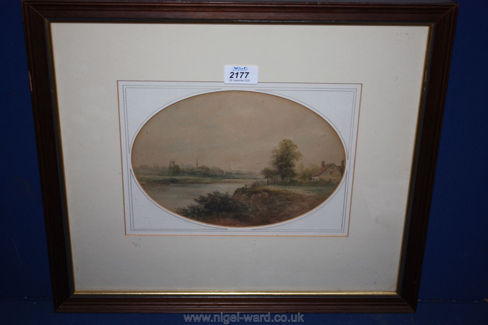 A framed, oval mounted Watercolour 'View Across Meadows to Hereford Cathedral' by E.W. Gill, 1840.