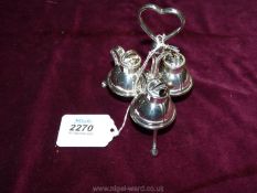 A pretty plated cruet set in the form of tiny ewer's,