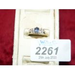 An 18 ct sapphire and diamond ring hallmarked size 'N 1/2'.