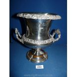 A two handled plated Urn decorated with grape vines, (wearing to base), 10" tall.