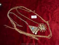 Two vintage necklaces in filigree metal with blue central stone and the other with multi stone