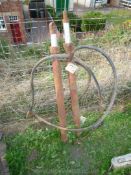 A pair of apparently double-acting fore-end loader hydraulic rams and supply hoses,