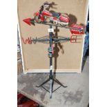 A modern style weather vane in the form of a motorcycle.