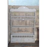 A grey painted kitchen display unit,