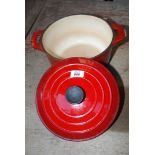 A burnt red Le Creuset 9 1/2" casserole dish.