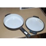A cast iron frying Pan with two handled lid