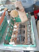 A Nuffield 3-cylinder Diesel cylinder head with valves and valve springs, rocker shaft and rockers,