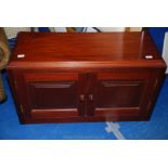 A wooden TV stand 39" long x 16" wide x 23" high.