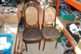 Pair of high backed bentwood chairs, cane backs and upholstered seats.