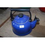 A blue Le Creuset gas kettle.