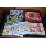 A box of seven unopened jigsaw puzzles 1,000 piece.