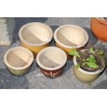 Five glazed pottery garden planters, various sizes up to 10'' diameter.