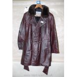A leather jacket with faux fur collar, size 12 3/4.