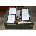A box of framed verses, poems, etc.