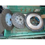 A new/unused Nuffield clutch pressure plate (blue springs) and two clutch plates including one of