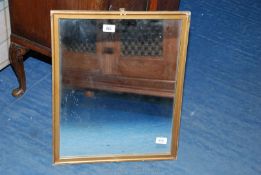 A wooden gilt framed mirror, 21" x 17".