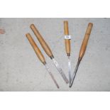 Four wooden handled turning chisels.