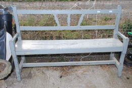 A painted wooden garden bench,