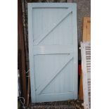 Large ledge and brace door 86'' high x 42 1/2'' wide.