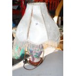 Pottery table lamp with damaged shade.