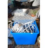 Large blue plastic basket of wheels, metal racking,