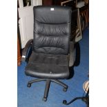 A faux leather office chair with small tear to seat.