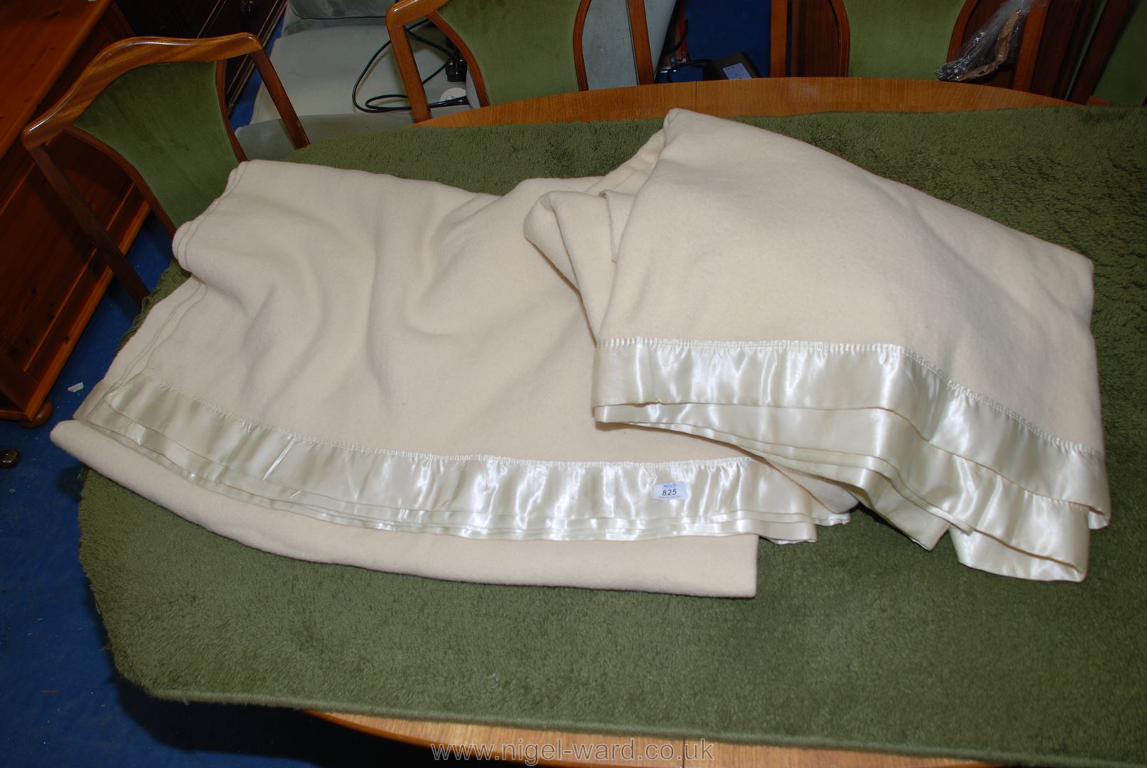 Two satin edged Whitney wool blankets, double size, cream colour.