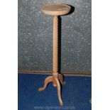 A barley twist jardiniere stand, 42" high x 11" diameter.