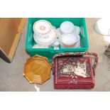 Box of Pyrex dining plates etc. and a sewing basket.