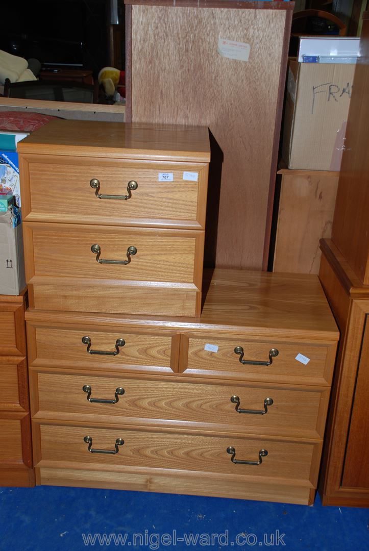 A two drawer teak style bedside cabinet and matching two drawer over three chest of drawers.