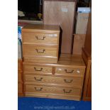 A two drawer teak style bedside cabinet and matching two drawer over three chest of drawers.