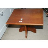 A small hardwood table on cross legs, 14" high x 16 1/2" x 20".