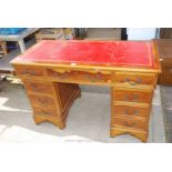 Two pedestal office desk with red leatherette insert top,