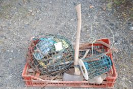 Crate of various bird feeders, hanging baskets,