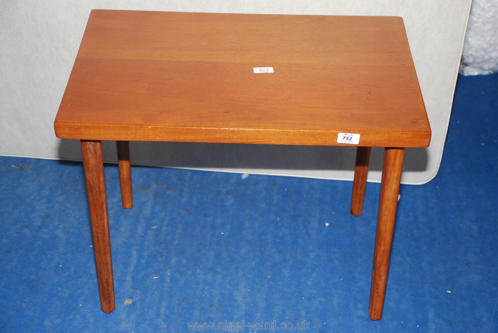 A teak occasional table, 26" long x 18" wide x 20" high.