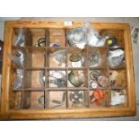 A pigeon-hole storage shelf unit containing a good quantity of mixed new spare parts including