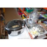 Large slow cooker and kitchen blending set with accessories.