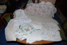 A quantity of bed linen including double sheets, single duvet and pillow cases,