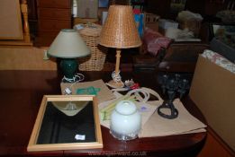 Table lamps, mirror, canvas shopping bags, heavy metal candelabra.