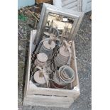 Wooden fruit box with a collection of various tilly lamps.