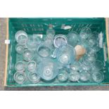 Crate of various drinking glasses and lemonade jugs.