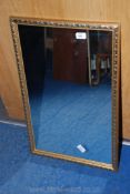 A wooden gilt framed wall mirror, 28" x 17 1/2".