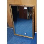 A wooden gilt framed wall mirror, 28" x 17 1/2".